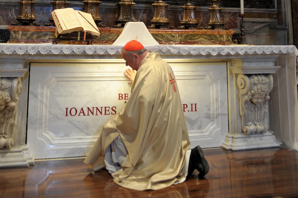 Polish Cardinal Stanislaw Dziwisz prays at the tomb of St. John Paul II in St. Peter's Basilica at the Vatican in May 2011. (CNS/L'Osservatore Romano)