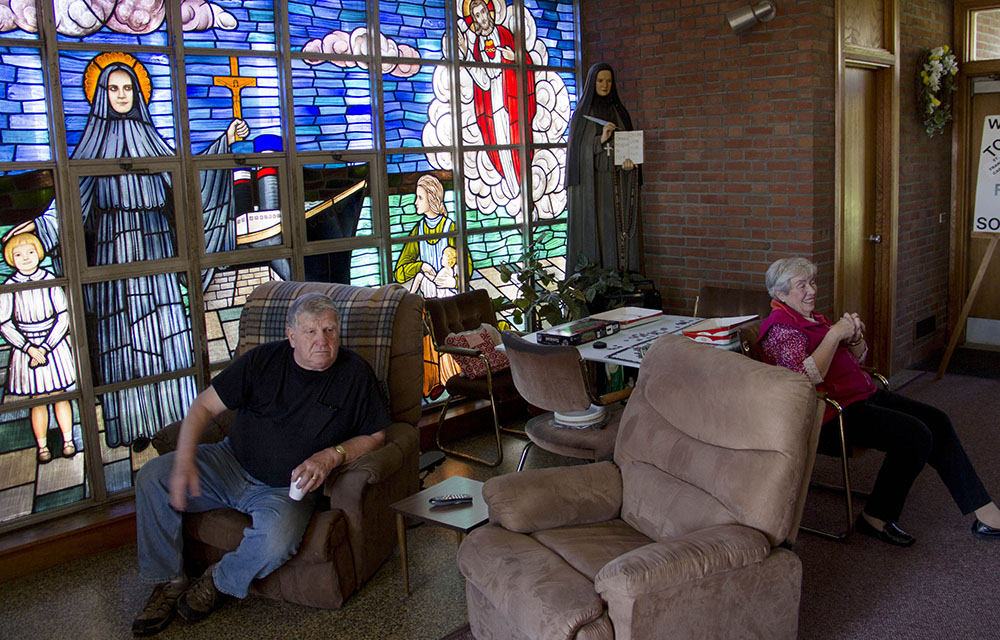 Former parishioners at the now-closed St. Frances Cabrini Church in Scituate, Massachusetts, are seen holding a vigil in May 2015. (CNS/The Pilot/Christopher S. Pineo)