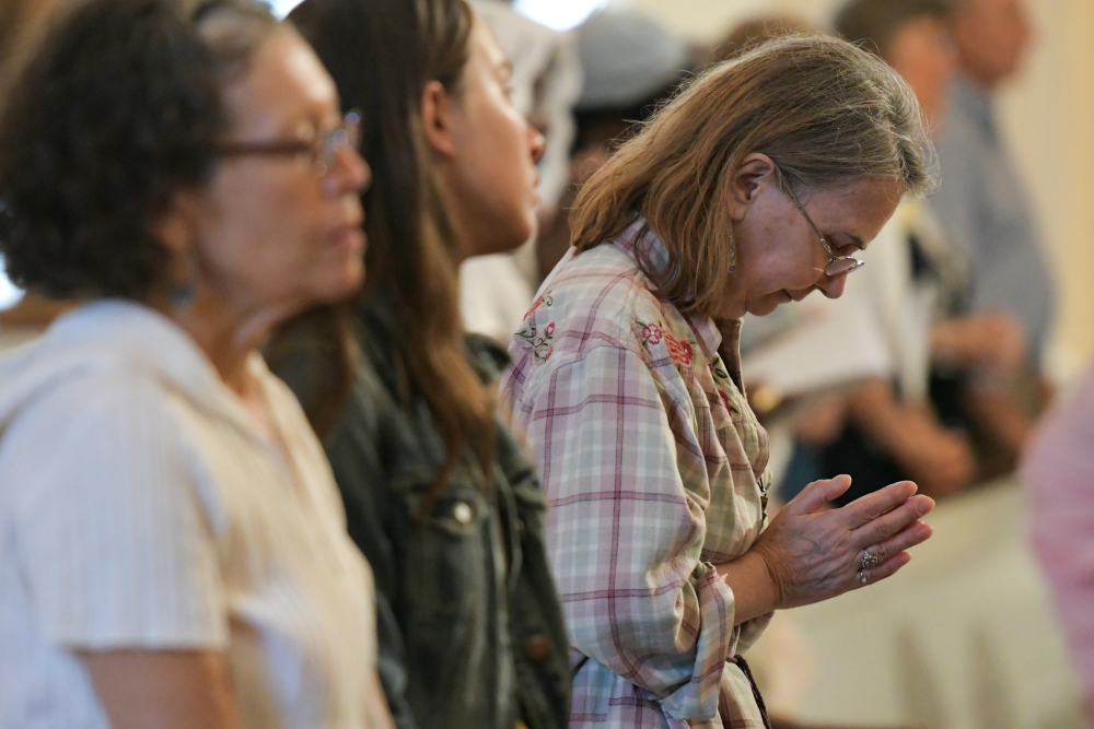 A woman prays during the opening Mass of the Fortnight for Freedom June 21, 2017, at the Basilica of the National Shrine of the Assumption of the Blessed Virgin Mary in Baltimore. (CNS/Catholic Review/Kevin J. Parks)