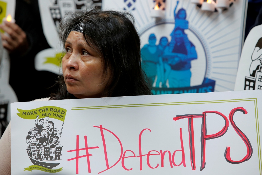 Salvadoran immigrant Mirna Portillo listens during a news conference Jan. 8 at the New York Immigration Coalition in Manhattan following President Donald Trump's announcement to end temporary protected status for Salvadorans. (CNS/Reuters/Andrew Kelly)