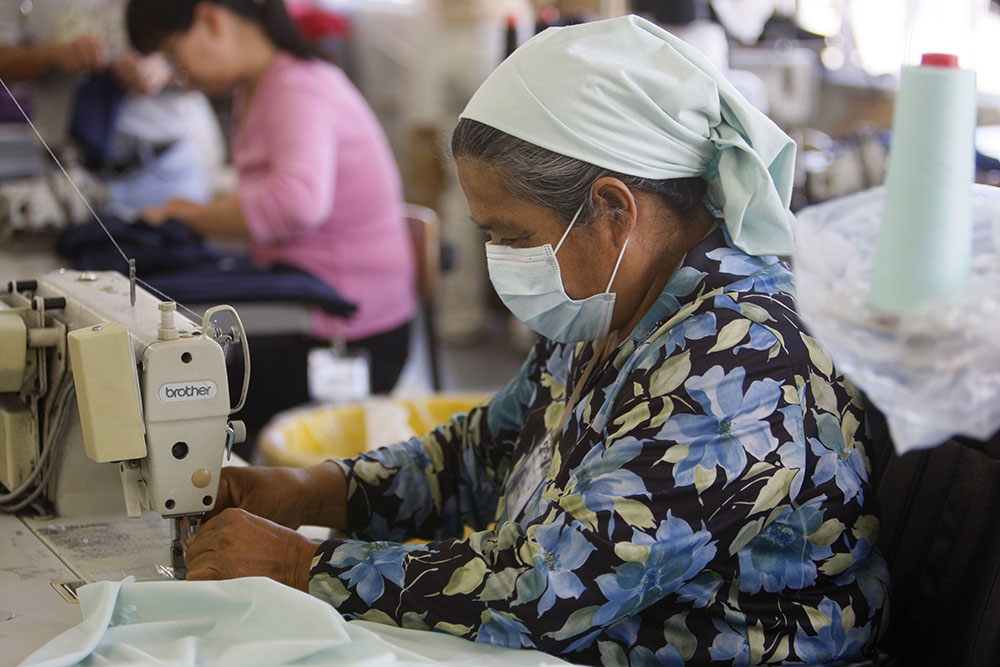 An immigrant from Mexico works at an apparel factory in downtown Los Angeles. (CNS/Reuters/Lucy Nicholson)