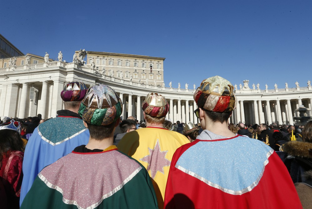 Children dressed as the Magi attend the Angelus led by Pope Francis from the window of his studio overlooking St. Peter's Square at the Vatican Jan. 1. (CNS/Paul Haring) 