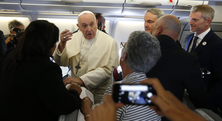 Pope Francis greets journalists aboard his flight from Rome to Maputo, Mozambique, Sept. 4, 2019. (CNS/Paul Haring)