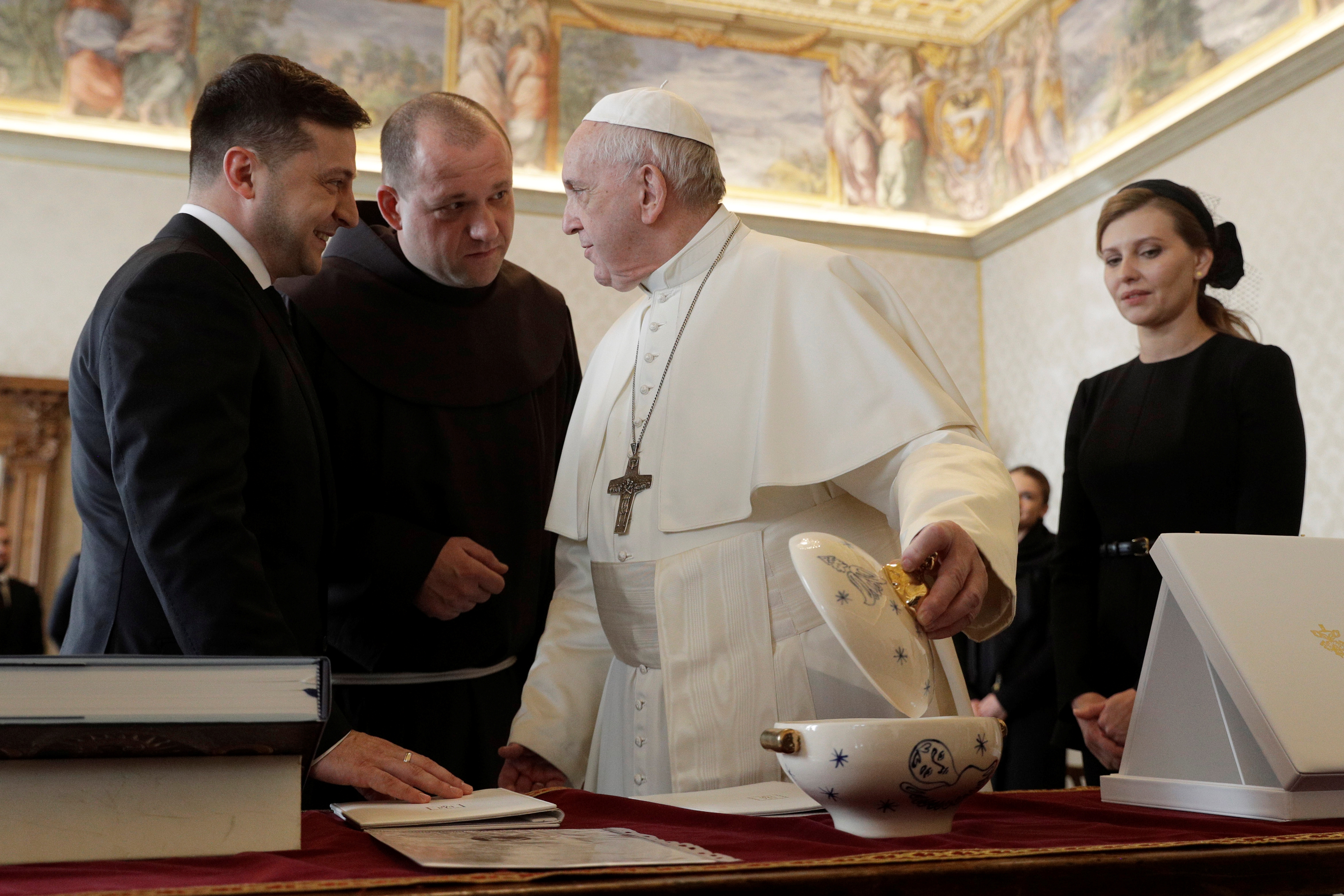 Pope Francis exchanges gifts with Ukrainian President Volodymyr Zelensky during a private audience at the Vatican Feb. 8, 2020. (CNS/Gregorio Borgia, pool via Reuters)