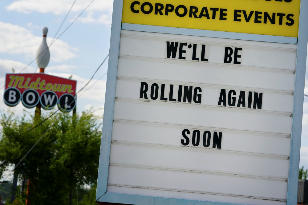 A message in Atlanta is seen on a sign outside the Midtown Bowl bowling alley April 21 days before the phased reopening of businesses and restaurants from coronavirus disease restrictions. (CNS/Reuters/Elijah Nouvelage)