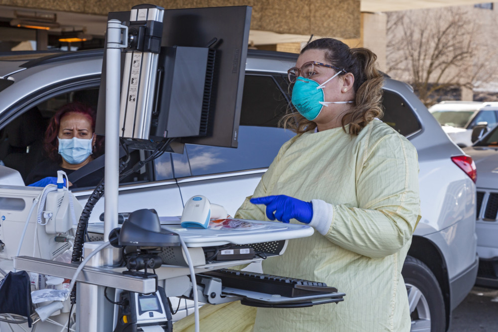 A health care worker in Royal Oak, Michigan, tests for the coronavirus outside Beaumont Hospital March 17, 2020. (CNS/Jim West)