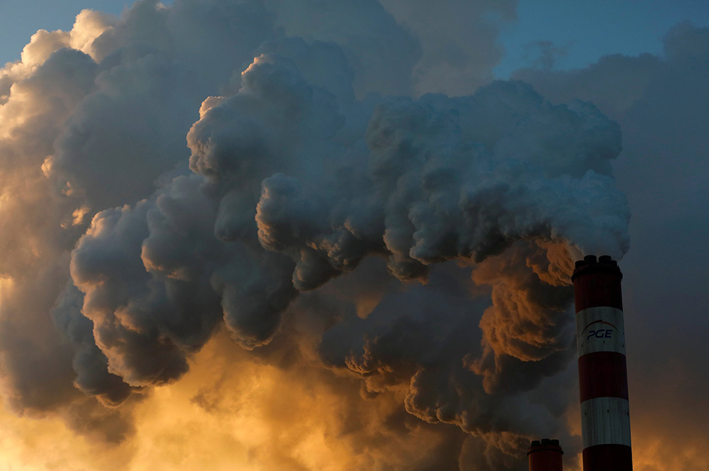 Smoke and steam billow from a coal plant in Belchatow, Poland, in 2018. (CNS/Reuters/Kacper Pempel)