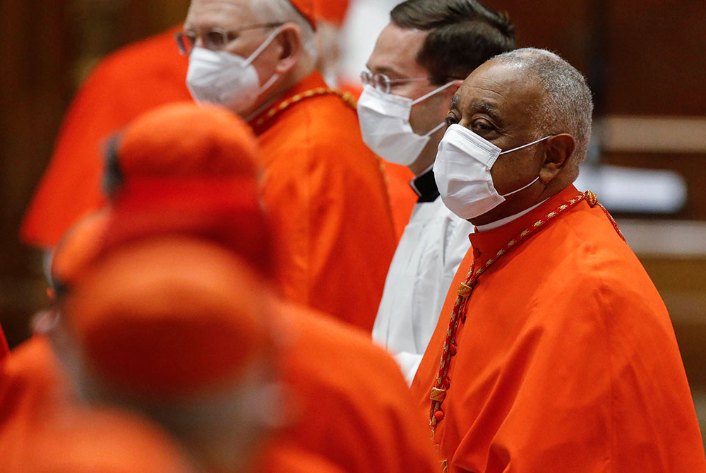 Cardinal Wilton Gregory of Washington wears a protective mask as he attends a consistory led by Pope Francis in St. Peter's Basilica Nov. 28 at the Vatican. Gregory was among 13 new cardinals created by the pope. (CNS/Fabio Frustaci, Reuters pool)