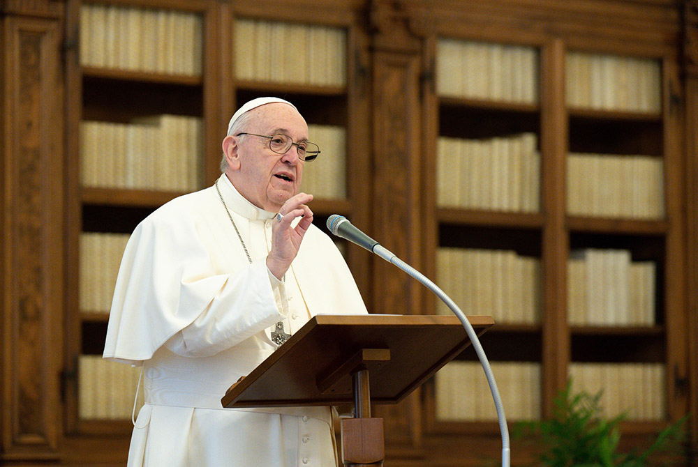 Pope Francis leads the midday recitation of the Angelus Jan. 17, 2021, from the library of the Apostolic Palace at the Vatican. (CNS/Vatican Media)