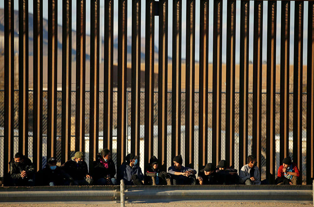 Migrants from Central America seeking asylum in the United States turn themselves in after crossing into El Paso, Texas, Jan. 22. (CNS/Reuters/Jose Luis Gonzalez)