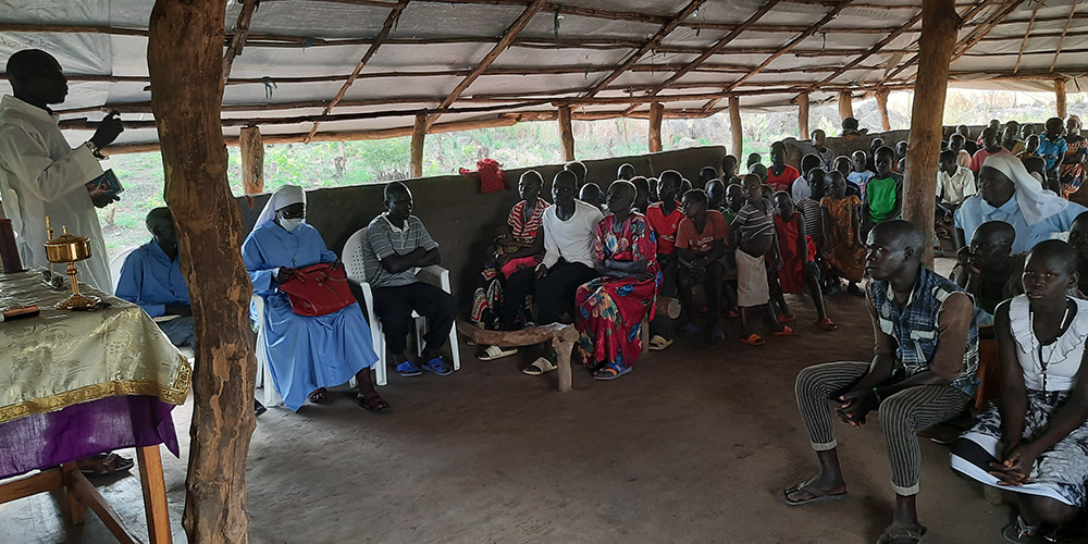 Mwaka Charles, a catechist, leads an Easter service in the absence of a priest in April 2021. (Courtesy of Lazar Arasu)