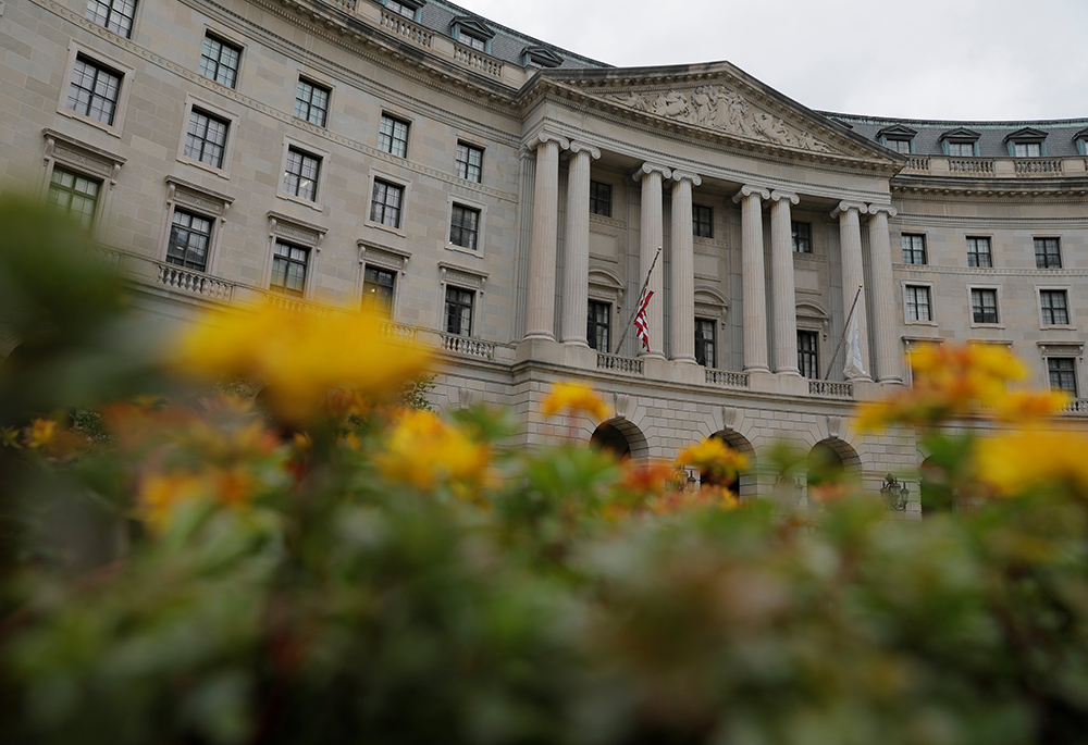 Flowers are seen in front of the headquarters of the Environmental Protection Agency May 10 in Washington. (CNS/Reuters/Andrew Kelly)