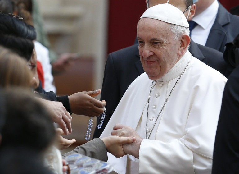 Pope Francis greets people during his general audience June 9 in the San Damaso Courtyard of the Apostolic Palace at the Vatican. (CNS/Paul Haring)