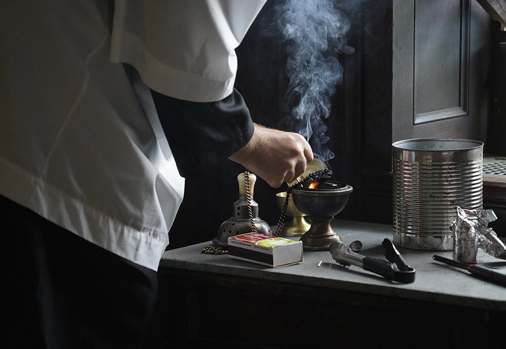 An altar server prepares a censer for use during a traditional Latin Mass at Immaculate Conception Seminary in Huntington, New York. (CNS/Gregory A. Shemitz)