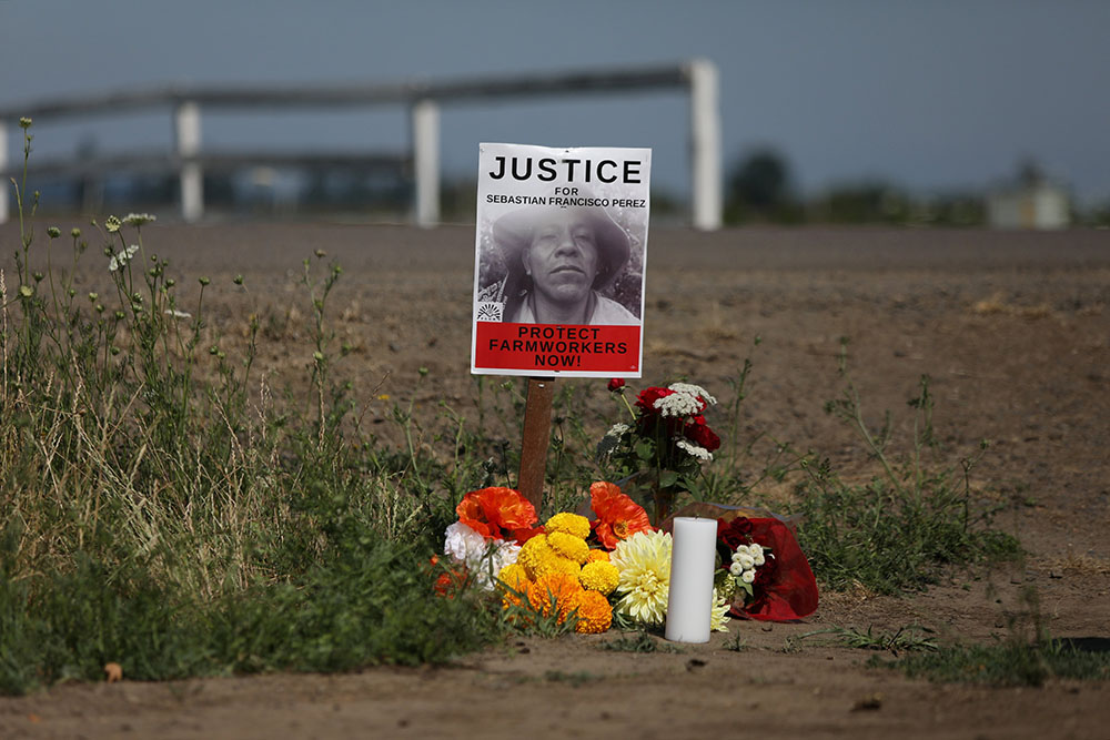 A makeshift memorial is seen in St. Paul, Oregon, July 3, where Guatemalan-born farmworker Sebastian Francisco Perez died during the heat wave a week earlier while moving field irrigation lines. (CNS/Reuters/Alisha Jucevic)