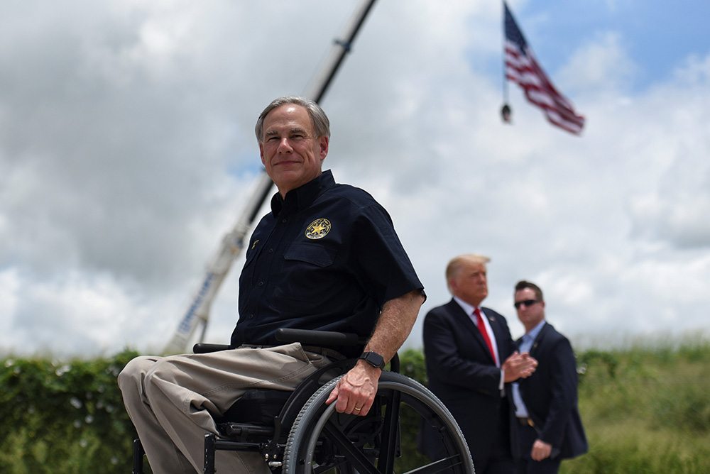 Texas Gov. Greg Abbott exits the stage with former President Donald Trump after a visit to an unfinished section of the wall along the U.S.-Mexico border in Pharr, Texas, June 30. (CNS/Reuters/Callaghan O'Hare)