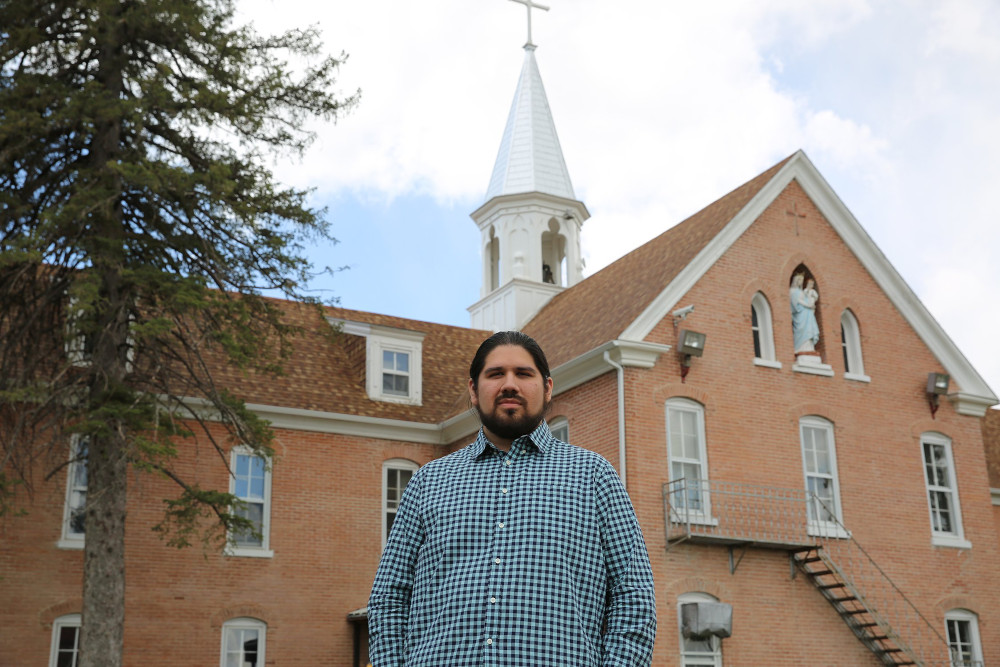 Maka Akan Najin Black Elk is seen in front of the Red Cloud Indian School in Pine Ridge, South Dakota, May 5, 2021. (CNS/Courtesy of Red Cloud Indian School/Marcus Fast Wolf)