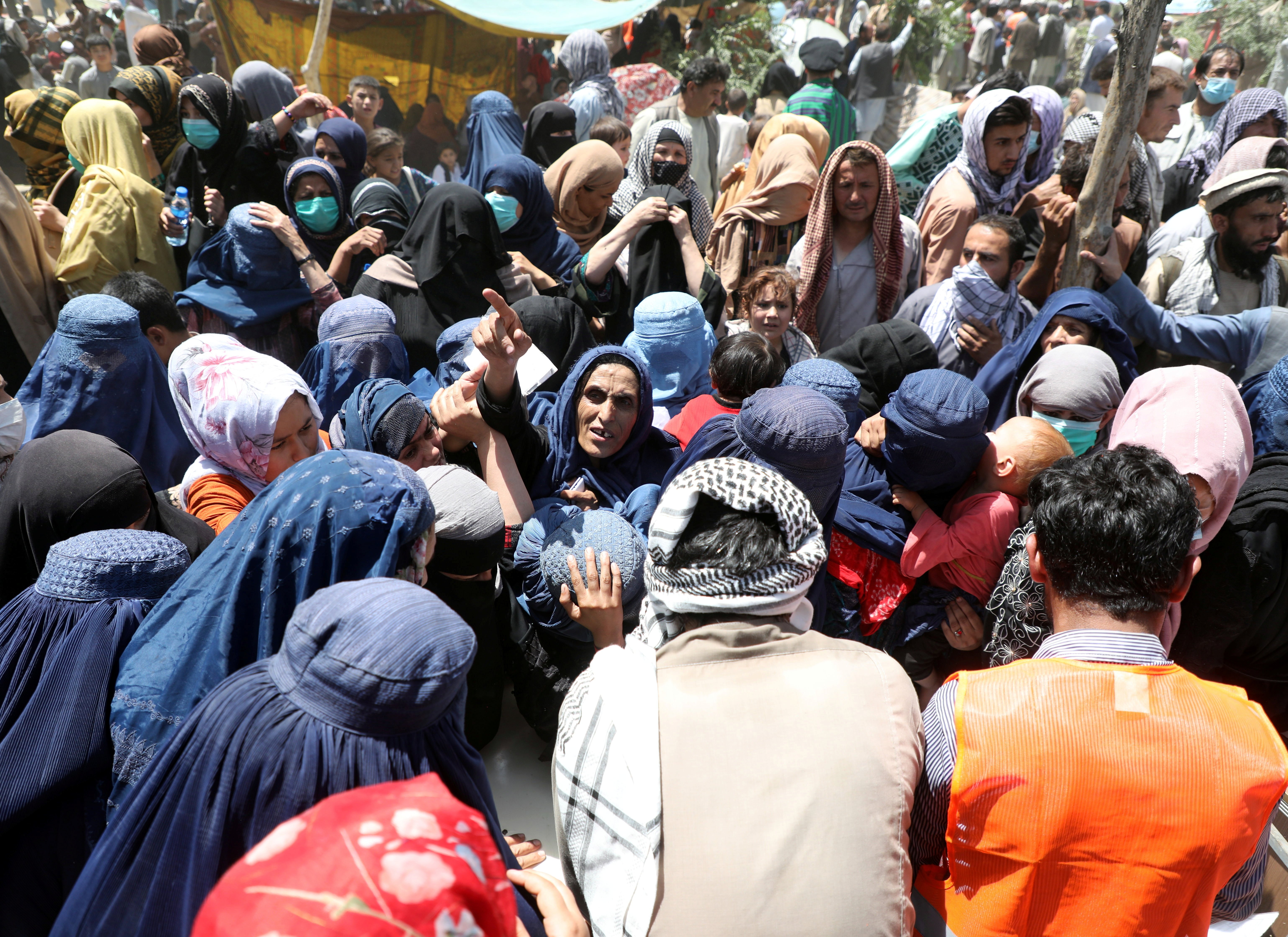 Internally displaced families from northern provinces of Afghanistan, who fled from their homes due the fighting between Taliban and Afghan security forces, take shelter at a public park in Kabul Aug. 10, 2021.