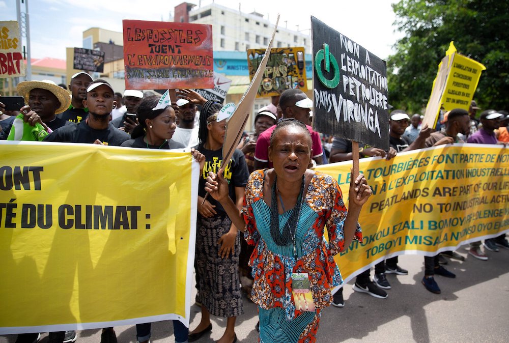 A woman leads environmental activists in a climate protest in Kinshasa, Congo, in November 2019. As they mark the Season of Creation, Catholics in Africa celebrate the Congo Basin as the second "lung" of the Earth. (CNS photo/Hereward Holland, Reuters)