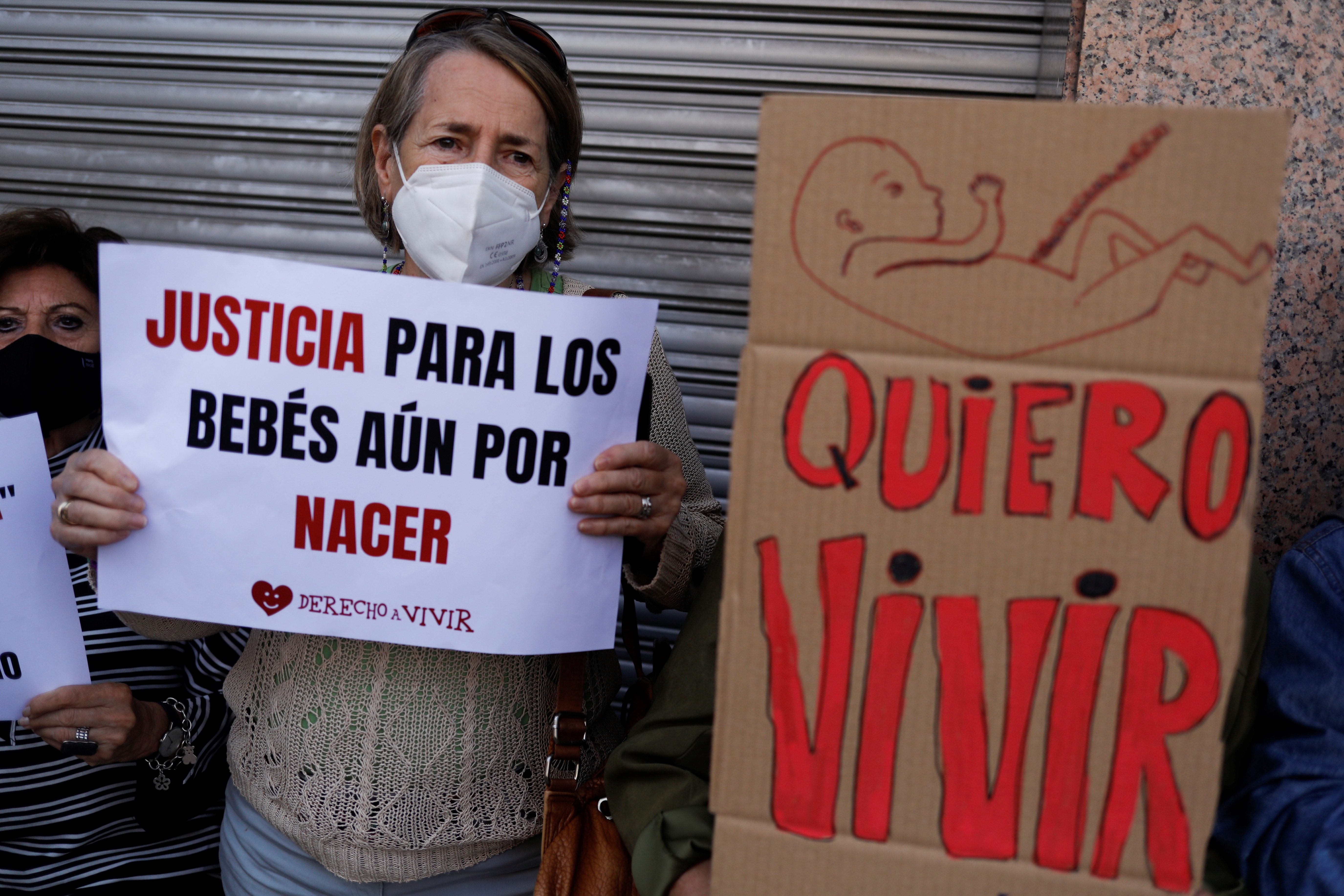 Supporters of anti-abortion organizations protest outside the Constitutional Court in Madrid Sept. 28, 2021. The banners read "Justice for unborn babies" and "I want to live." (CNS photo/Susana Vera, Reuters)