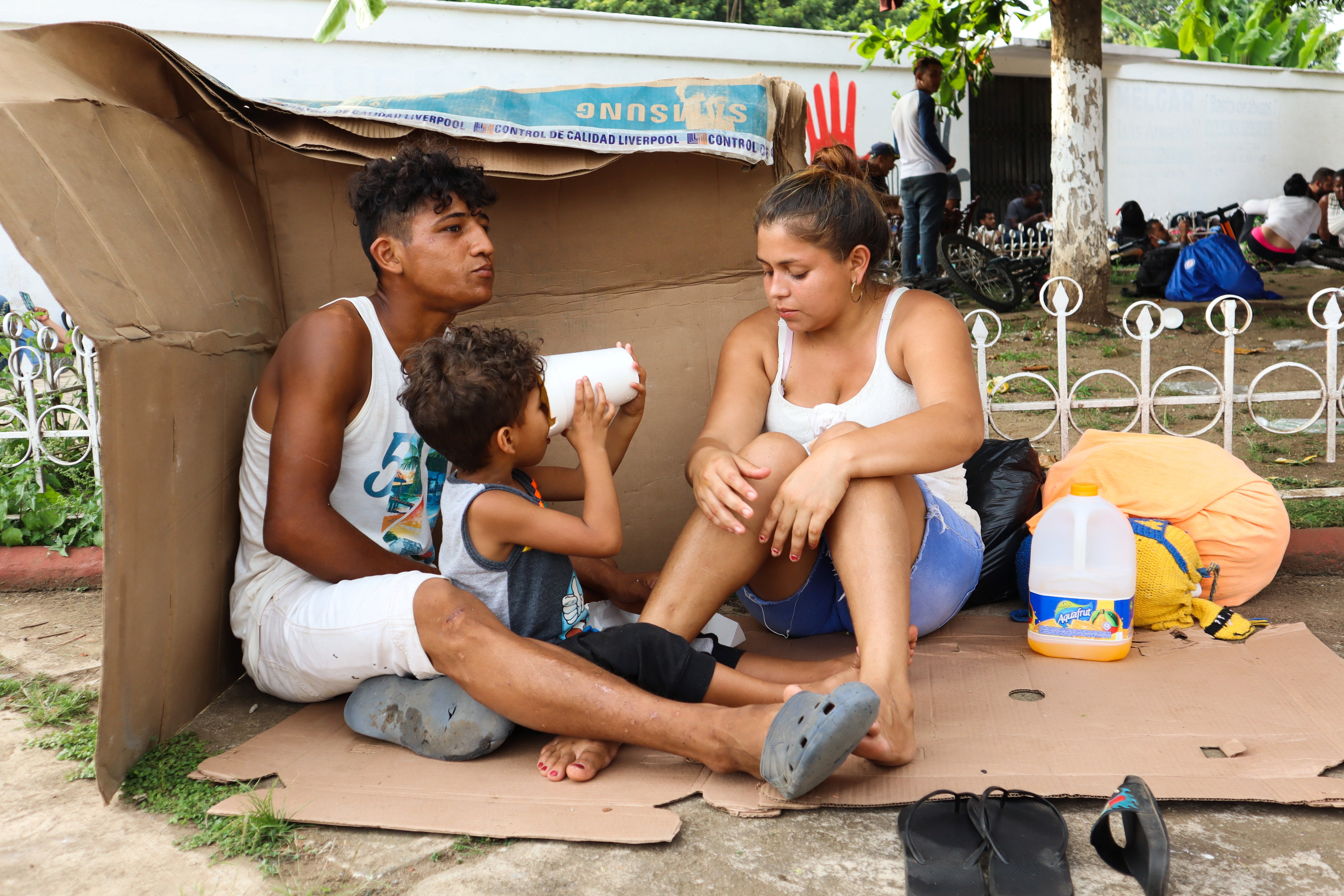  A migrant family in Huehuetán, Mexico, rests at a park with other caravan migrants heading to the U.S. border Nov. 18, 2021. (CNS photo/Jose Torres, Reuters)