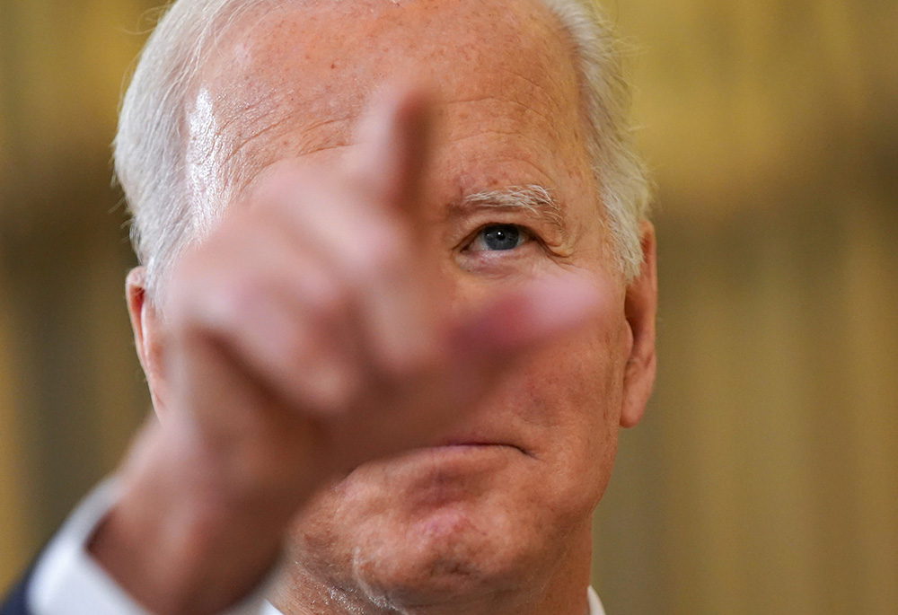 President Joe Biden delivers remarks on the November jobs report from the White House Dec. 3 in Washington. He convoked a two-day virtual summit on promoting democracy Dec 9. (CNS/Reuters/Kevin Lamarque)