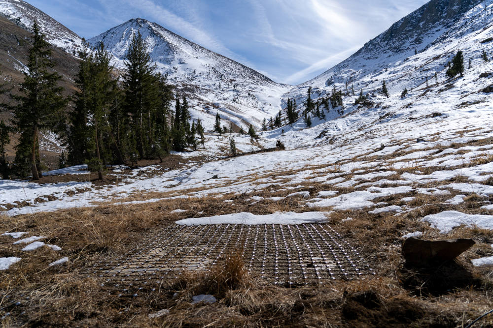 Snow pillows used for measuring snow water equivalent are covered with a bear net in the Kaweah Watershed at Southern Sequoia National Park in California, Nov. 18, 2021. (Kelly M. Grow/California Department of Water Resources)