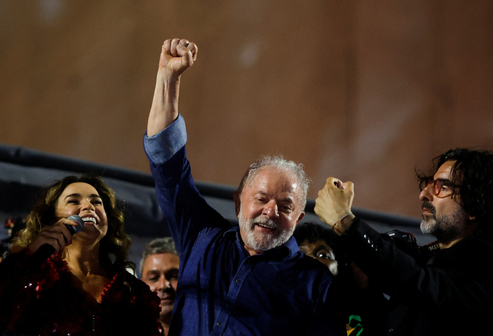 Luiz Inacio Lula da Silva lifts a raised fist at an election night gathering as he was proclaimed the winner in the Brazilian presidential election runoff, in São Paulo