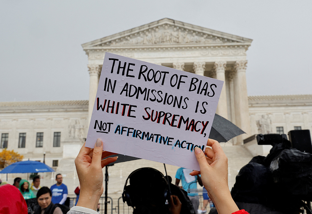 Supporters of affirmative action demonstrate near the U.S. Supreme Court building Oct. 31 in Washington. The court heard oral arguments in two cases challenging whether colleges may continue to use race as a factor in student admissions. (CNS/Reuters/Jonathan Ernst)