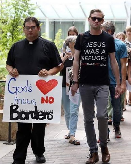 Father Guillermo Treviño, pastor of St. Joseph Church in West Liberty, Iowa, walks with members of the Iowa City Catholic Worker community to the office of U.S. Rep. Dave Loebsack, D-Iowa, to discuss immigration reform measures July 16, 2019. 