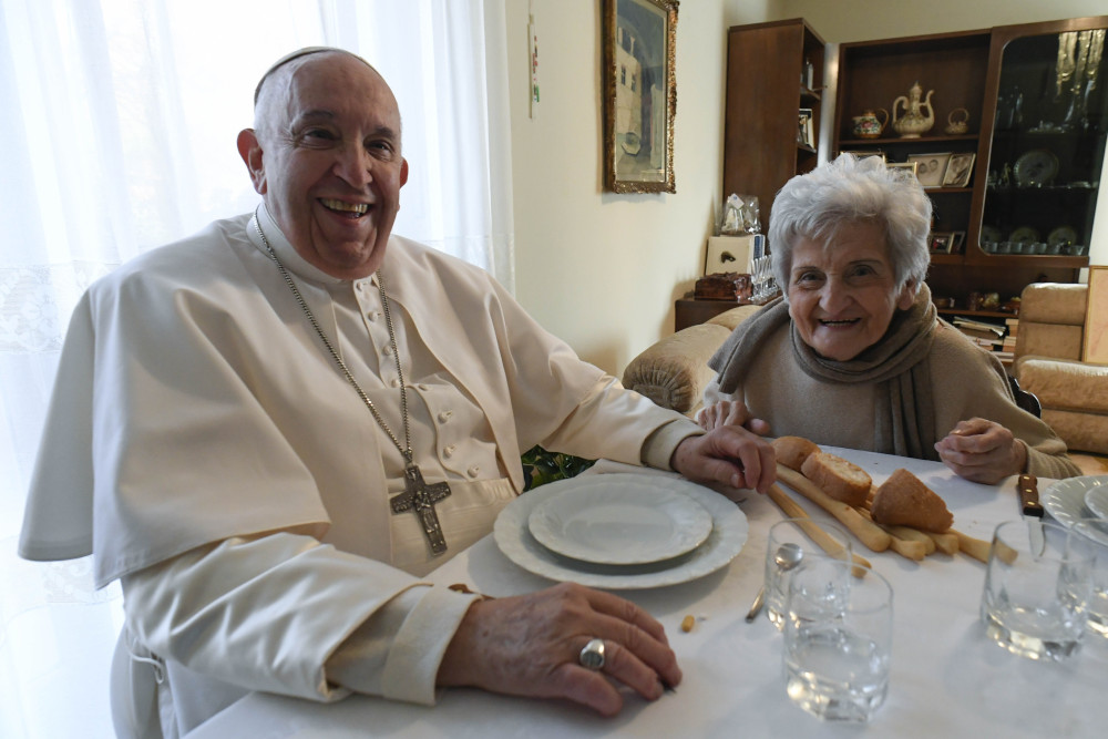 Pope Francis and Carla Rabezzana, his second cousin, sit down to lunch in her home in Portacomaro, near Asti, Nov. 19, 2022. 