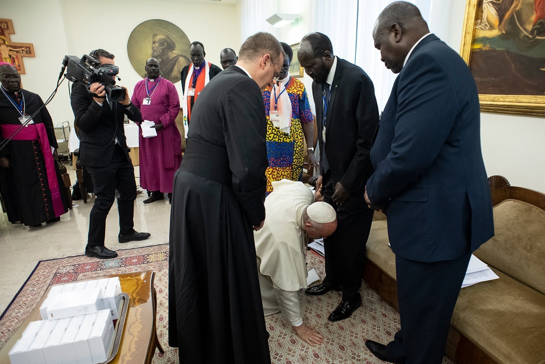 In this April 11, 2019 file photo, Pope Francis kneels at the feet of South Sudan President Salva Kiir at the conclusion of a two-day retreat for the African nation's political leaders, at the Vatican. This event was referenced at an international conference on nonviolence and the teaching of Pope Francis, held Dec. 5-7 in Rome. (CNS/Vatican Media via Reuters)