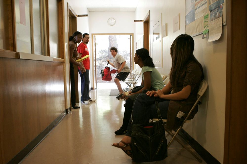 Jamila Griffith, left, calls a student for an appointment in the financial aid office at Holy Names University in Oakland, Calif., Aug. 17, 2007. University officials announced Dec. 19, 2022, that the school will close in May 2023 after educating students for 154 years. (CNS/Greg Tarczynski)