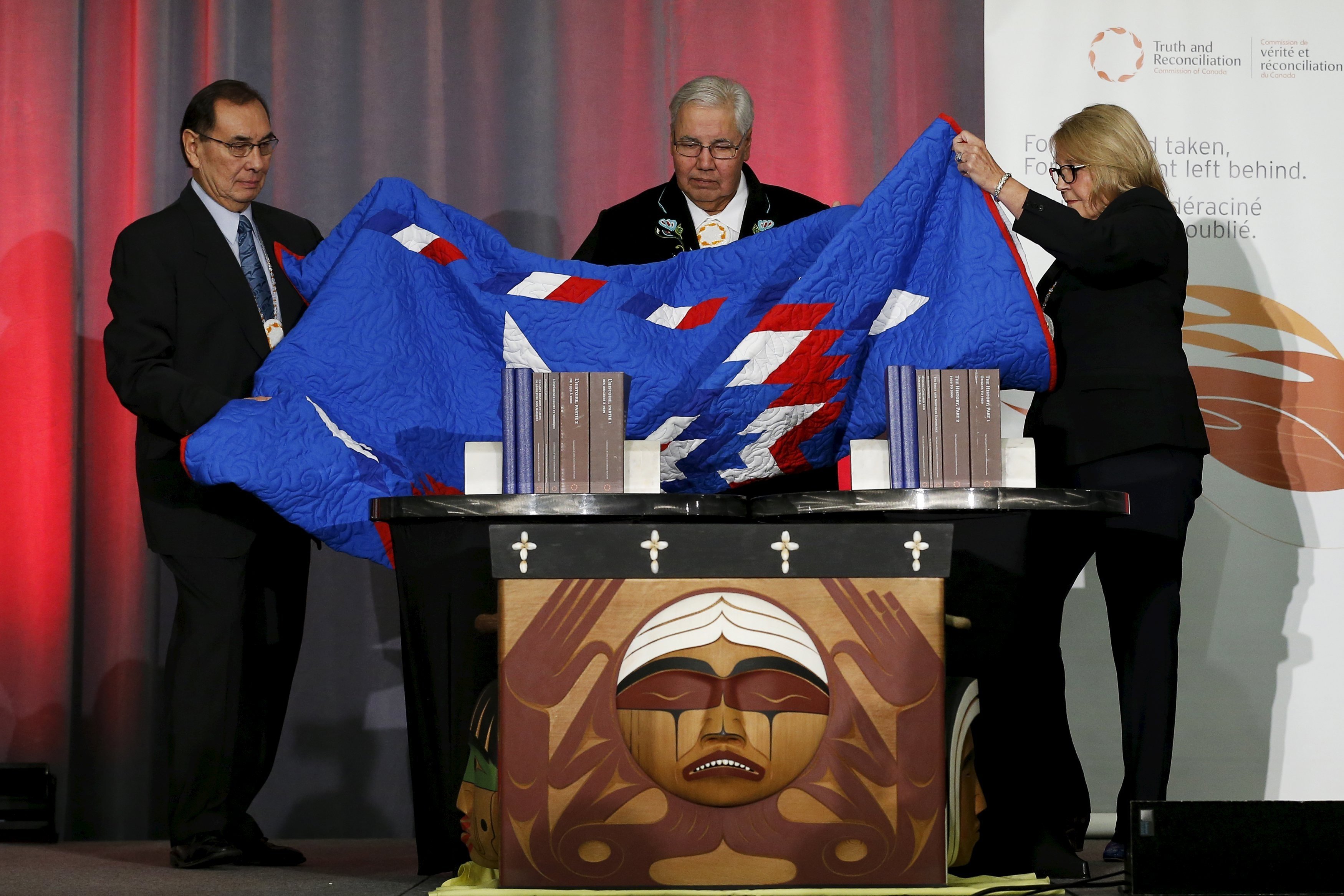 Cree Chief Wilton Littlechild, Justice Murray Sinclair and Commissioner Marie Wilson unveil the Truth and Reconciliation Commission's final report in Ottawa, Ontario, Dec. 15, 2015. (CNS photo/Chris Wattie, Reuters)