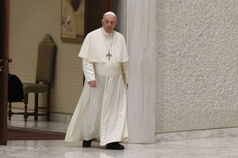 Pope Francis arrives to lead his general audience in the Paul VI hall at the Vatican March 23. (CNS/Paul Haring)