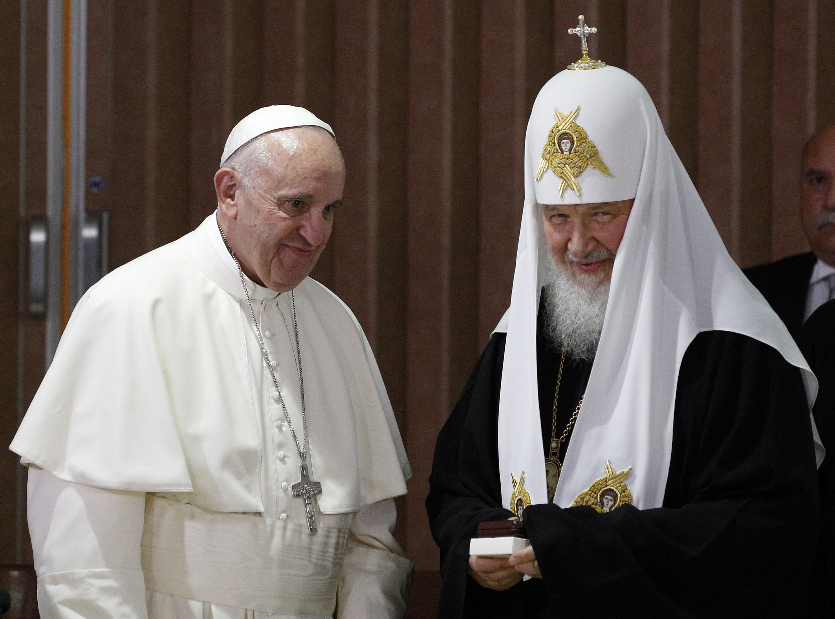 Pope Francis presents gifts to Russian Orthodox Patriarch Kirill of Moscow after the leaders signed a joint declaration during a meeting at Jose Marti International Airport in Havana in this Feb. 12, 2016, photo. (CNS photo/Paul Haring)