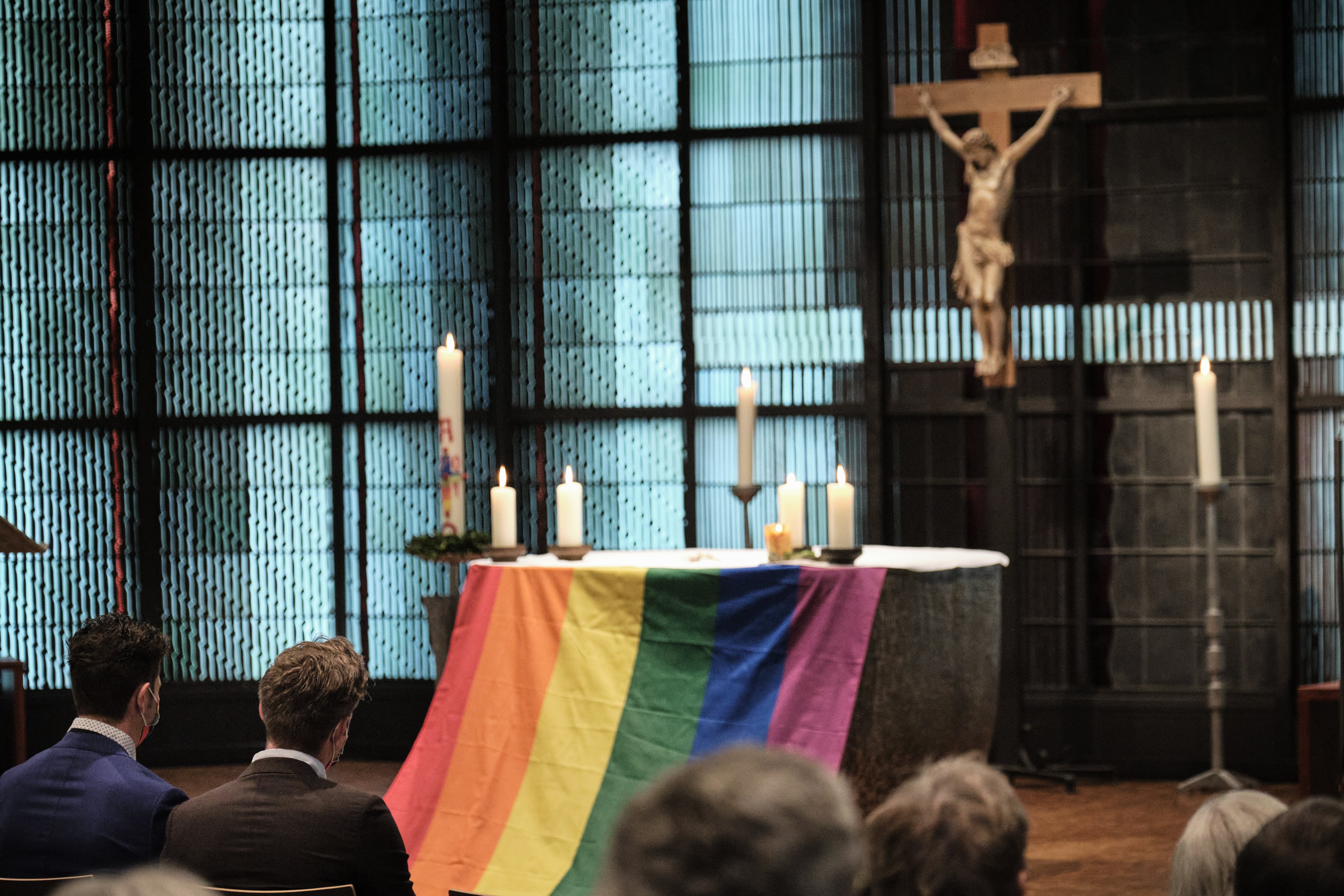 The altar is draped with a rainbow flag during the blessing service "Love Wins" in the Church of St. Martin in Geldern, Germany, May 6, 2021. (CNS photo/Rudolf Wichert, KNA)