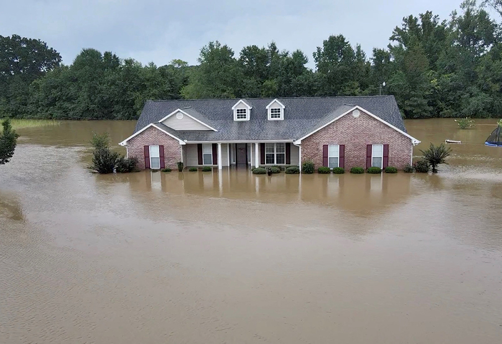 A building in Canton, Mississippi, is submerged amid flooding Aug. 24. (CNS/Tommy Keith Grant via Reuters) 