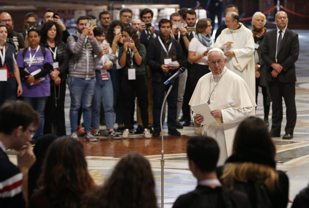 Pope Francis prepares to address young people who participated in a pilgrimage hike from the Monte Mario nature reserve in Rome to St. Peter's Basilica at the Vatican Oct. 25, 2018, during the Synod of Bishops on young people, the faith and vocational dis