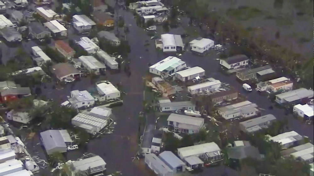 An aerial view shows homes surrounded by floodwaters in Lee County, Fla., Sept. 29, 2022, after Hurricane Ian caused widespread destruction across the Sunshine State. (CNS photo/WPLG TV via ABC via Reuters)