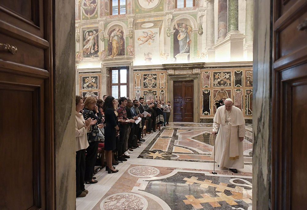 Pope Francis uses a cane as he leaves an audience with participants attending a conference promoting educational initiatives for migrants and refugees, Sept. 29 at the Vatican. (CNS/Vatican Media)