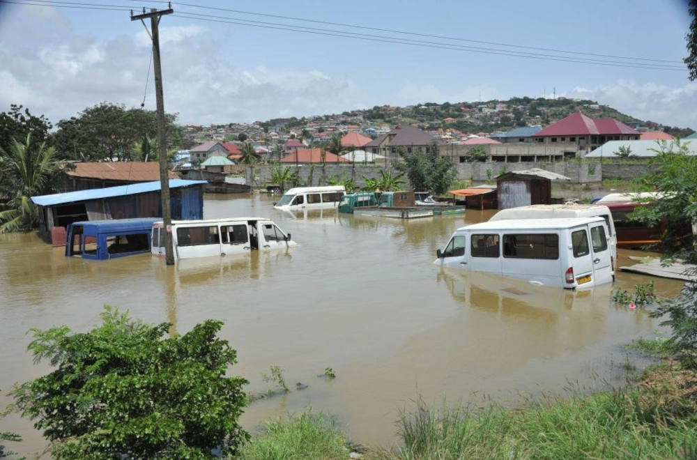 Vehicles are pictured in floodwaters Oct. 5, 2022, in a suburb of Accra, Ghana, after heavy rains caused spillage of the Weija dam. (CNS photo/courtesy St. Peter Church, Tetegu)