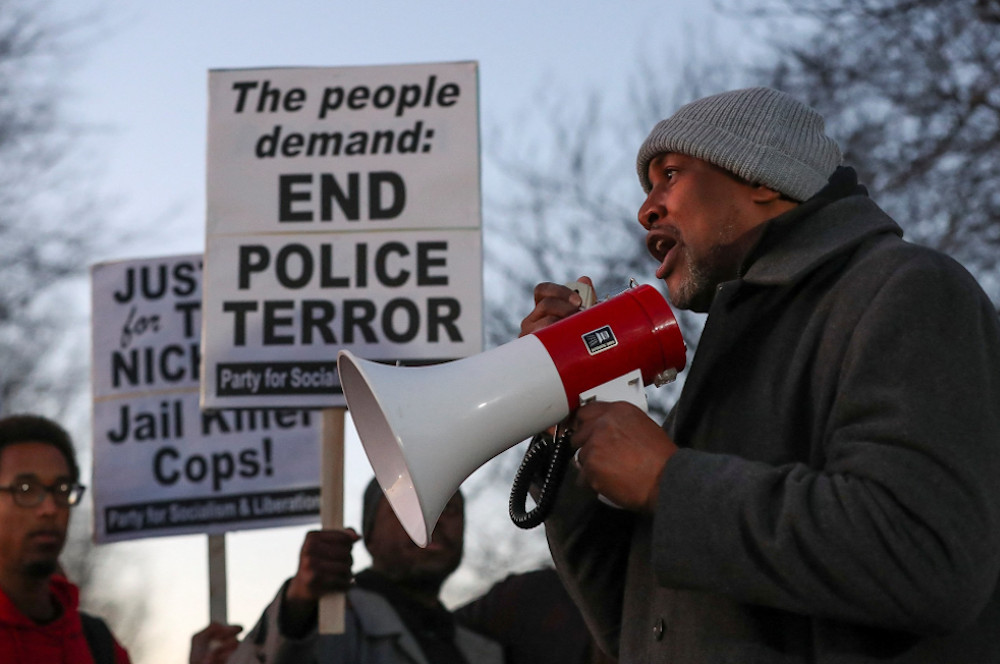 A man speaks through a bullhorn during a protest in Memphis, Tennessee, Jan. 27, on the day of the release of the video showing police officers beating Tyre Nichols, the young Black man who was killed as a result of a traffic stop by Memphis police officers. (OSV News/Reuters/Alyssa Pointer)