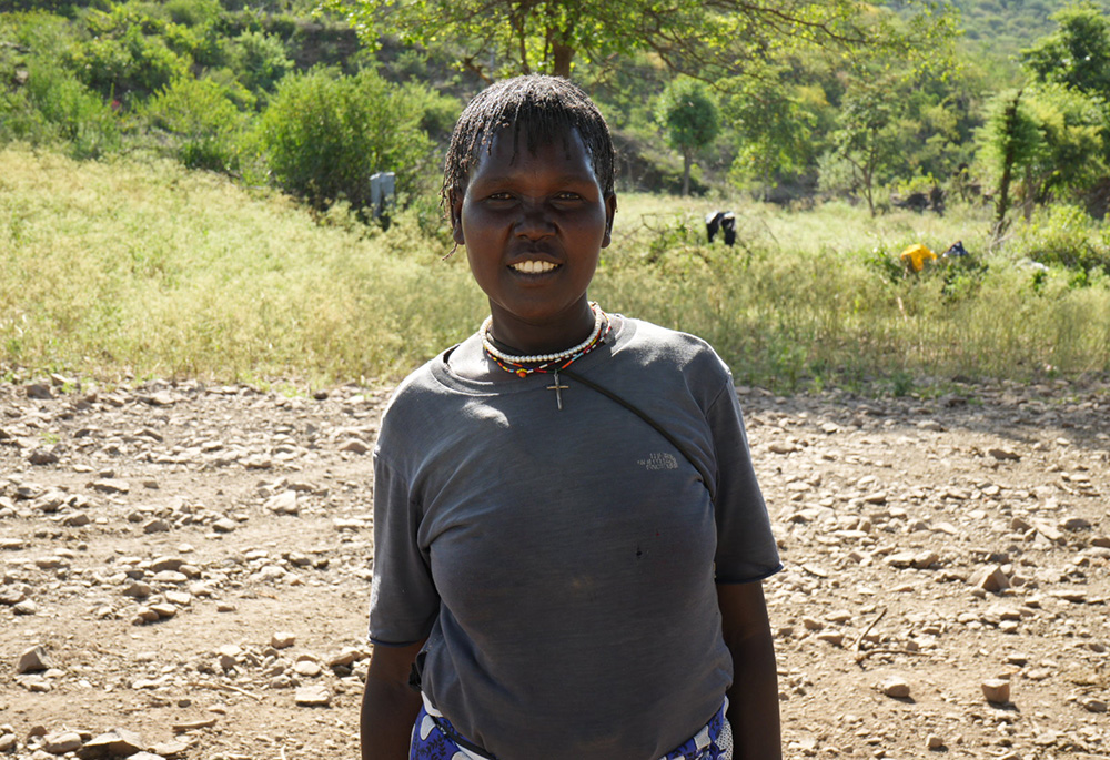 Mary Tireng, a 40-year-old mother of eight, is a beneficiary of the Incarnate Word Sisters' Rotu Mission. The congregation employs her as a translator for their outreach programs, and she has become financially stable thanks to the women's table banking initiative against hunger, which the sisters also pioneered. (GSR photo/Wycliff Peter Oundo)