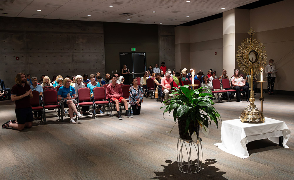 Participants in the Salt Lake City Diocese's Eucharistic Rally and Mass July 9 at the Mountain America Expo Center in Sandy, Utah, spend time in adoration before the Blessed Sacrament. The diocesanwide event was the culmination of the "Year of Diocesan Revival," the first stage of the National Eucharistic Revival. (OSV News/Sam Lucero)