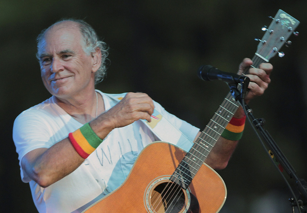 Jimmy Buffett performs at his sister's restaurant in Gulf Shores, Alabama, on June 30, 2010. (AP/Dave Martin, File)