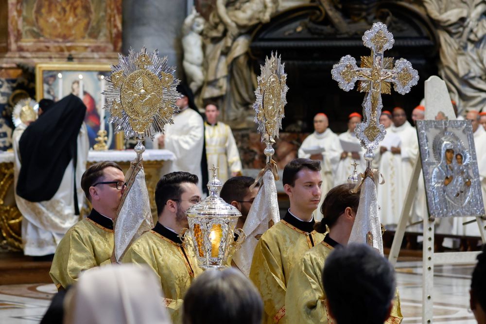 Servers lead the procession around the Altar of the Chair in St. Peter's Basilica during a Byzantine Divine Liturgy as part of the assembly of the Synod of Bishops at the Vatican Oct. 9. (CNS/Lola Gomez)