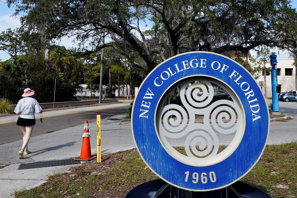 A student makes her way past the sign at New College of Florida in Sarasota, Florida, Jan. 20. 