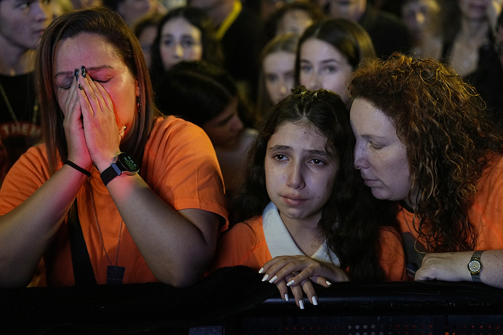 Relatives and friends of hostages held in the Gaza Strip by the Hamas militant group call for their release in the Hostages Square at the Museum of Art in Tel Aviv, Israel, Dec. 2. (AP/Ariel Schalit)