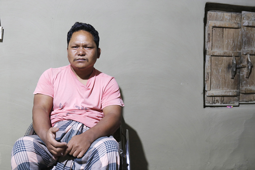 Utpal Nokrek, a Garo Indigenous Catholic, was paralyzed by the police opening fire during a peaceful protest in 2004 in the Madhupur area of Tangail in central Bangladesh. The Garo people were marching to protest the construction of an artificial "eco-park" on natural forest land where they live in Bangladesh. (Stephan Uttom Rozario)